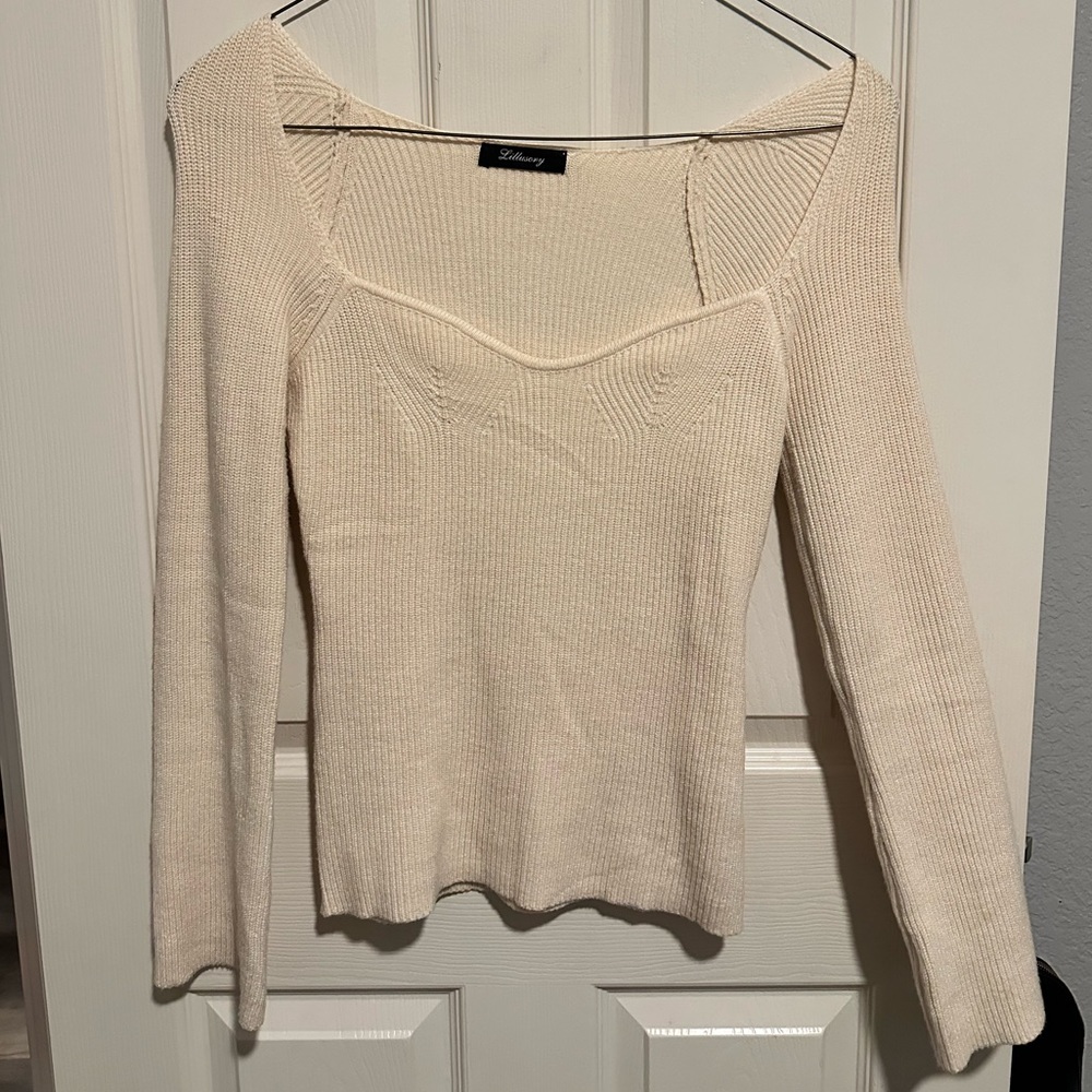 cream colored long sleeve top